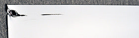 Fig 2: The 24.375" rolls of 20mil DigiMag get squeezed into the edge guides and the edges bunch up, causing head strikes.